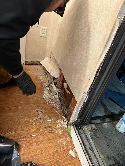 Water seeping through a foundation wall in a Brockton basement