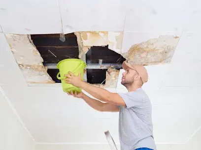 Water-stained and sagging ceiling from an overhead leak in a Brockton home
