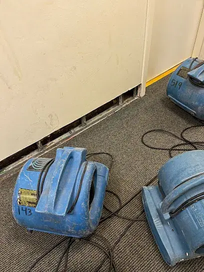 Air movers and dehumidifiers drying a Brockton home after water damage